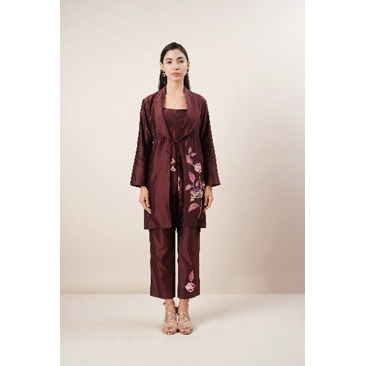 Sienna Coord- set (3 Piece) in pure Chanderi Silk fabric. The jacket is detailed with tie-knot opening and intricate thread embroidery. It is paired with a corset and embroidered trousers.