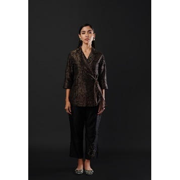 Wrap-on Blazer in Tissue fabric paired with pure Chanderi Trousers. The garment is detailed with subtle thread work embroidery.